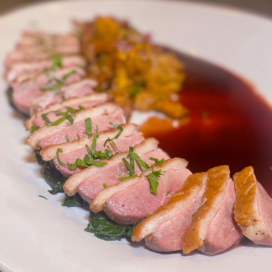Pan-Roasted Duck Breast with Kale, Chanterelles, Radishes, and Port Wine Sauce